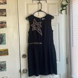 Sleeveless above the knee black dress with shooting star design